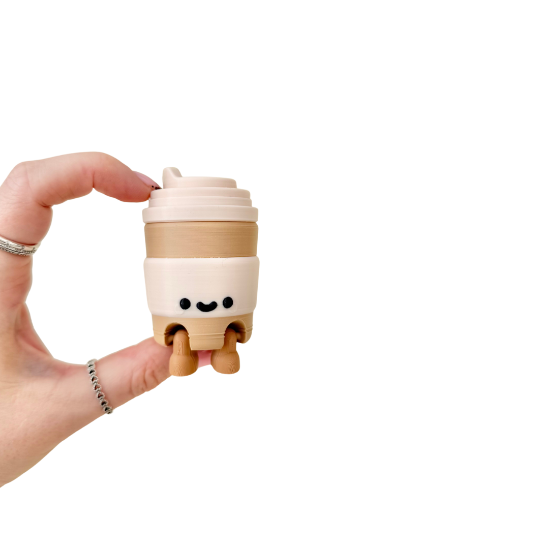 Cute decorative cup with a friendly face and sit-anywhere legs for workspace and home display
