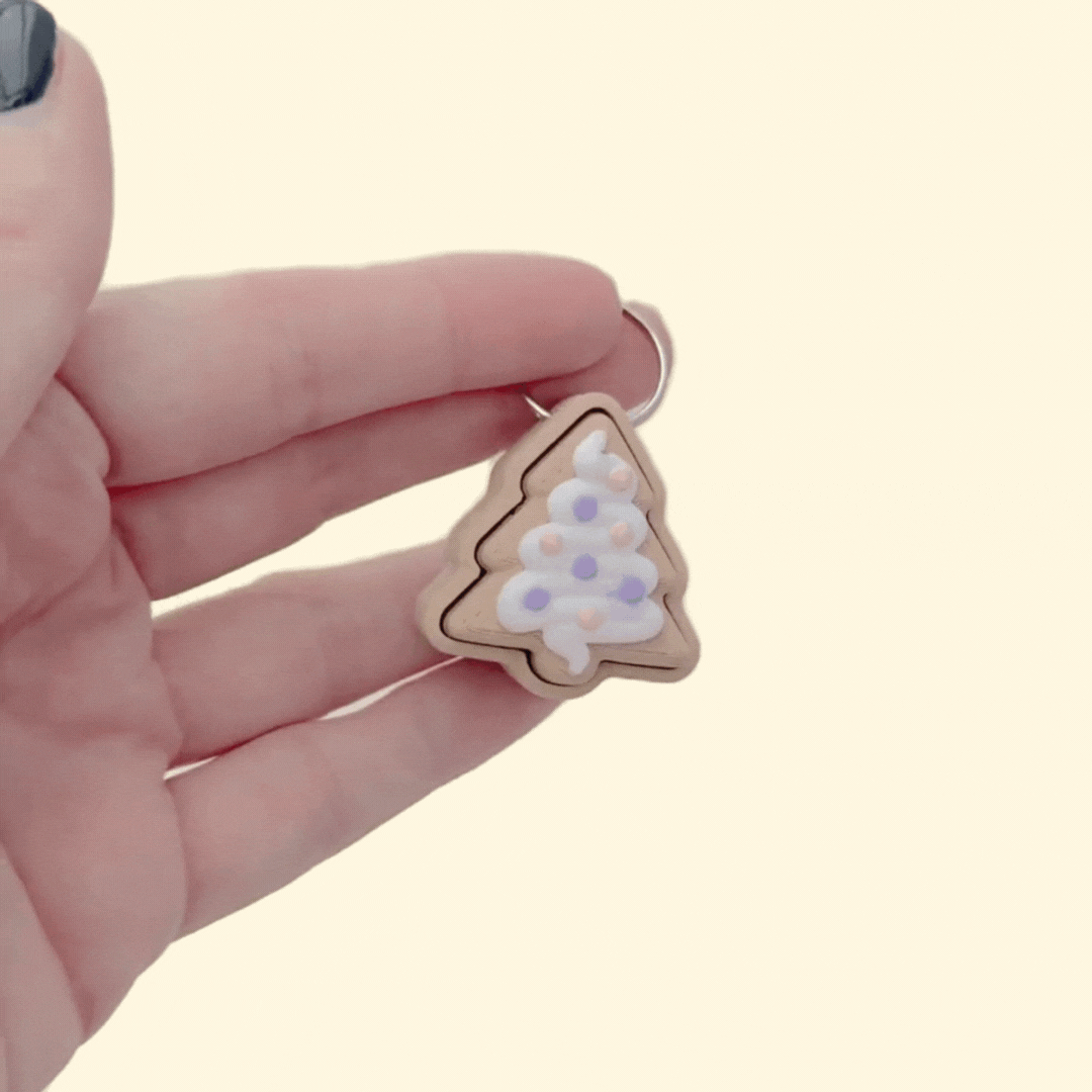 Star biscuit fidget with textured icing and a simple press action; pocket size with keyring loop.
