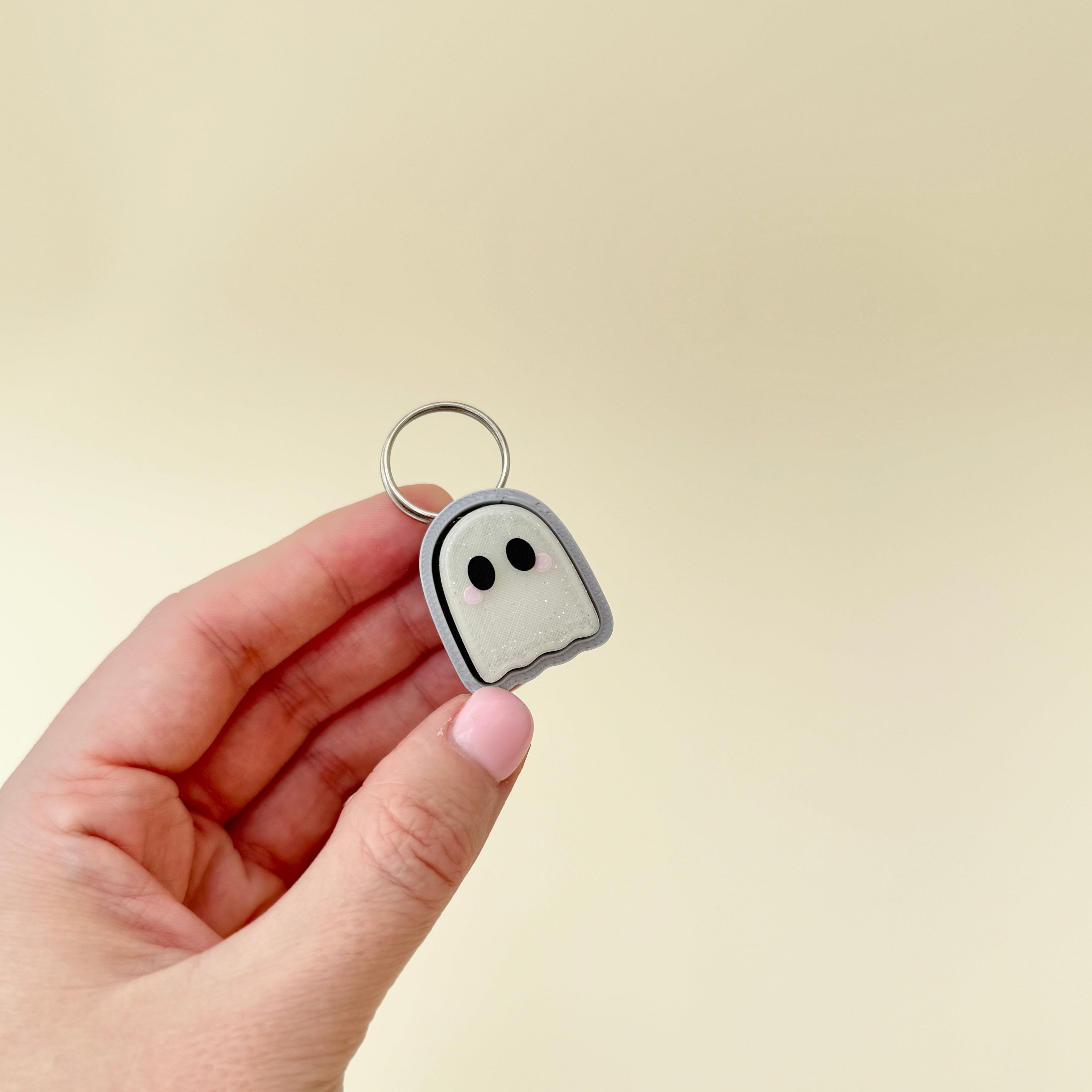 Frosted ghost clicker with tactile click buttons and Halloween design
