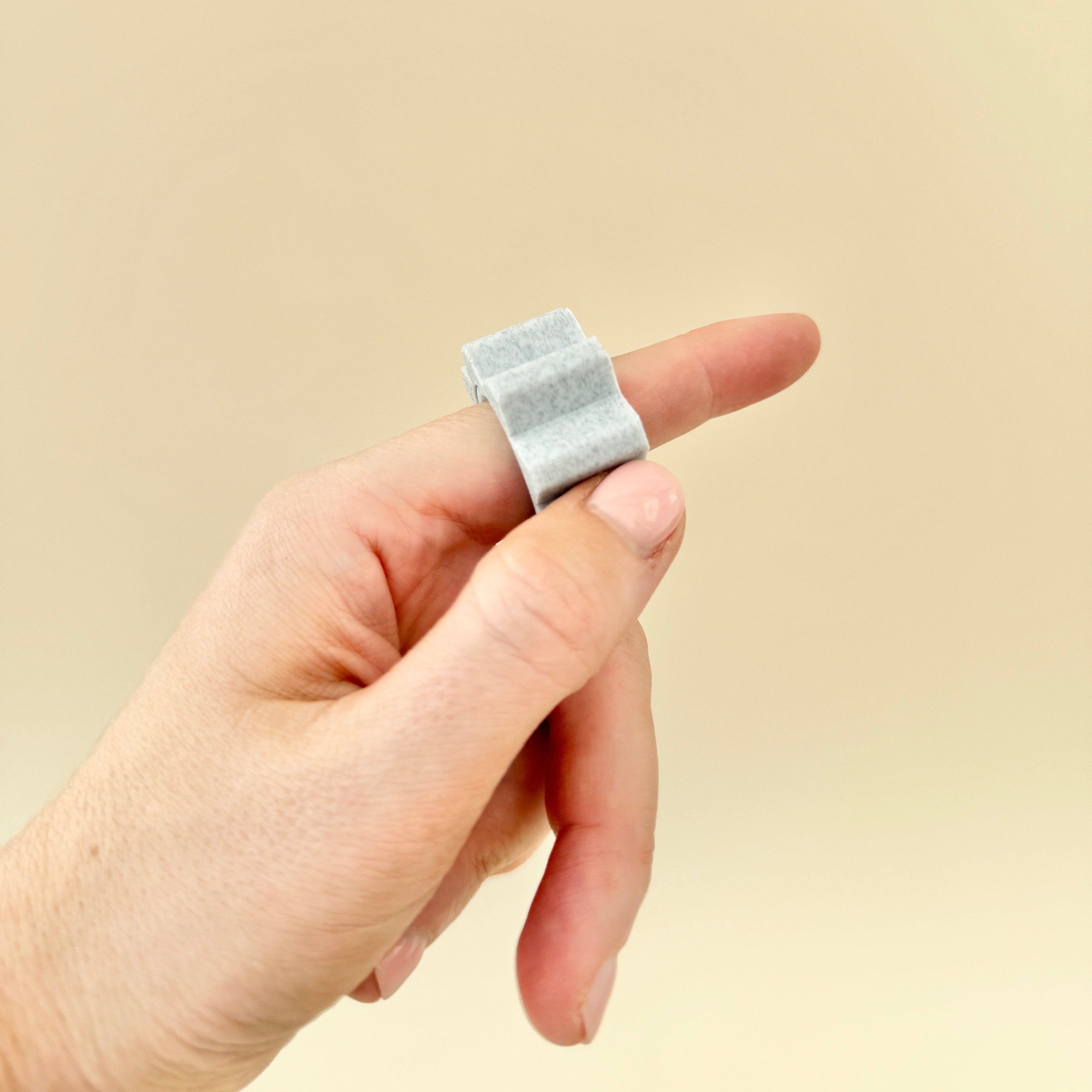 A gear-like fidget ring with small, raised bumps for a satisfying tactile feel.