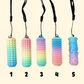 Textured sensory stim tools in rainbow and nude tones, designed for palm use