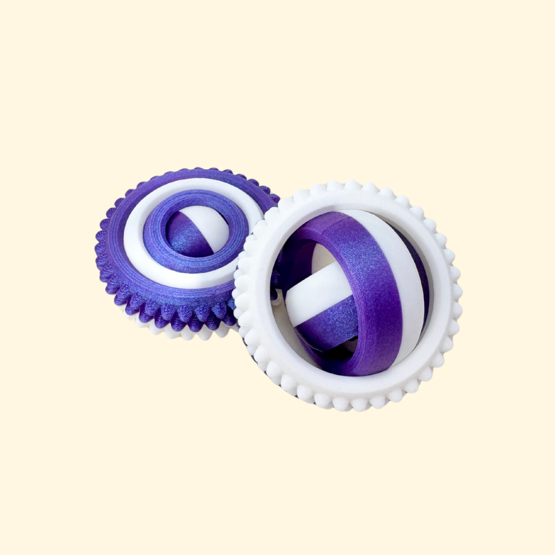 Textured four-part fidget spinner with bumpy outer ring.
