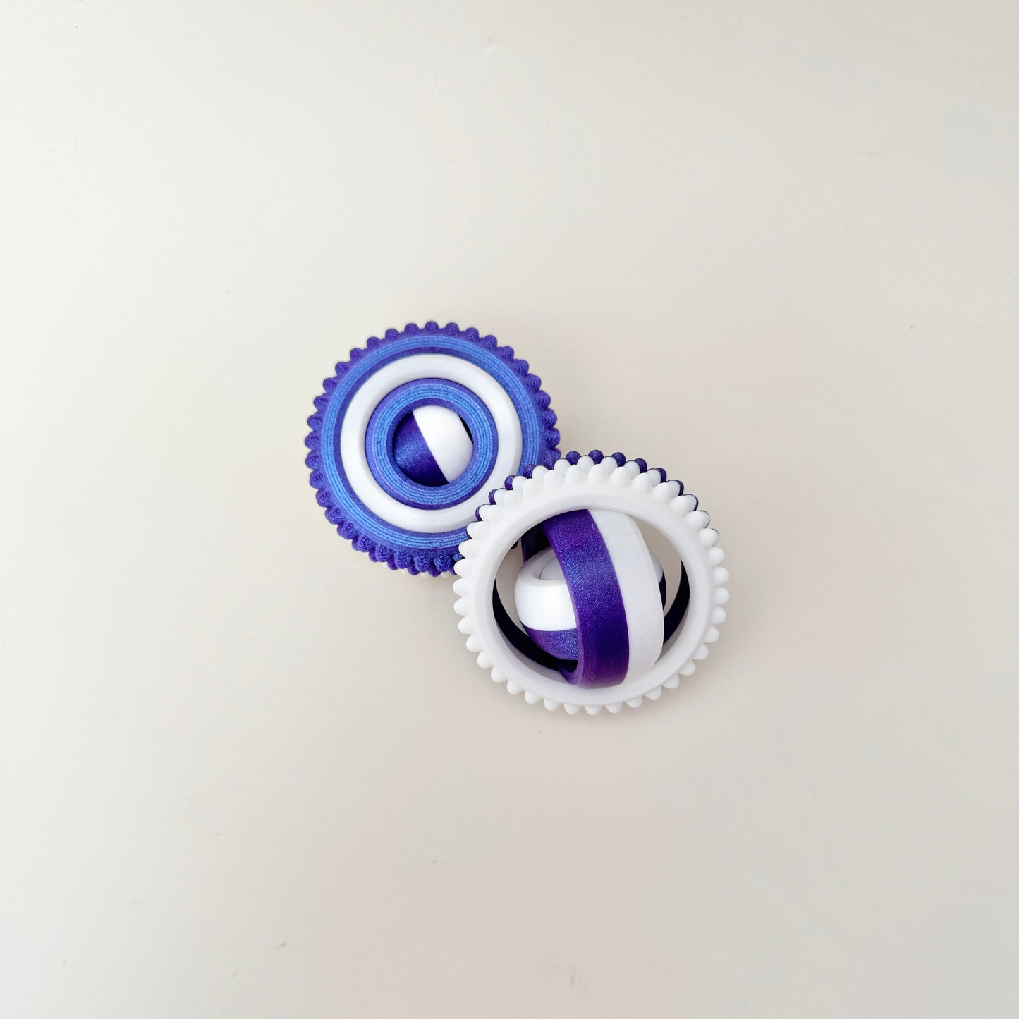 Bumpy-edge spinner for thumb tracing and movement.
