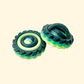 green 4-ring fidget spinner with textured edge for sensory play
