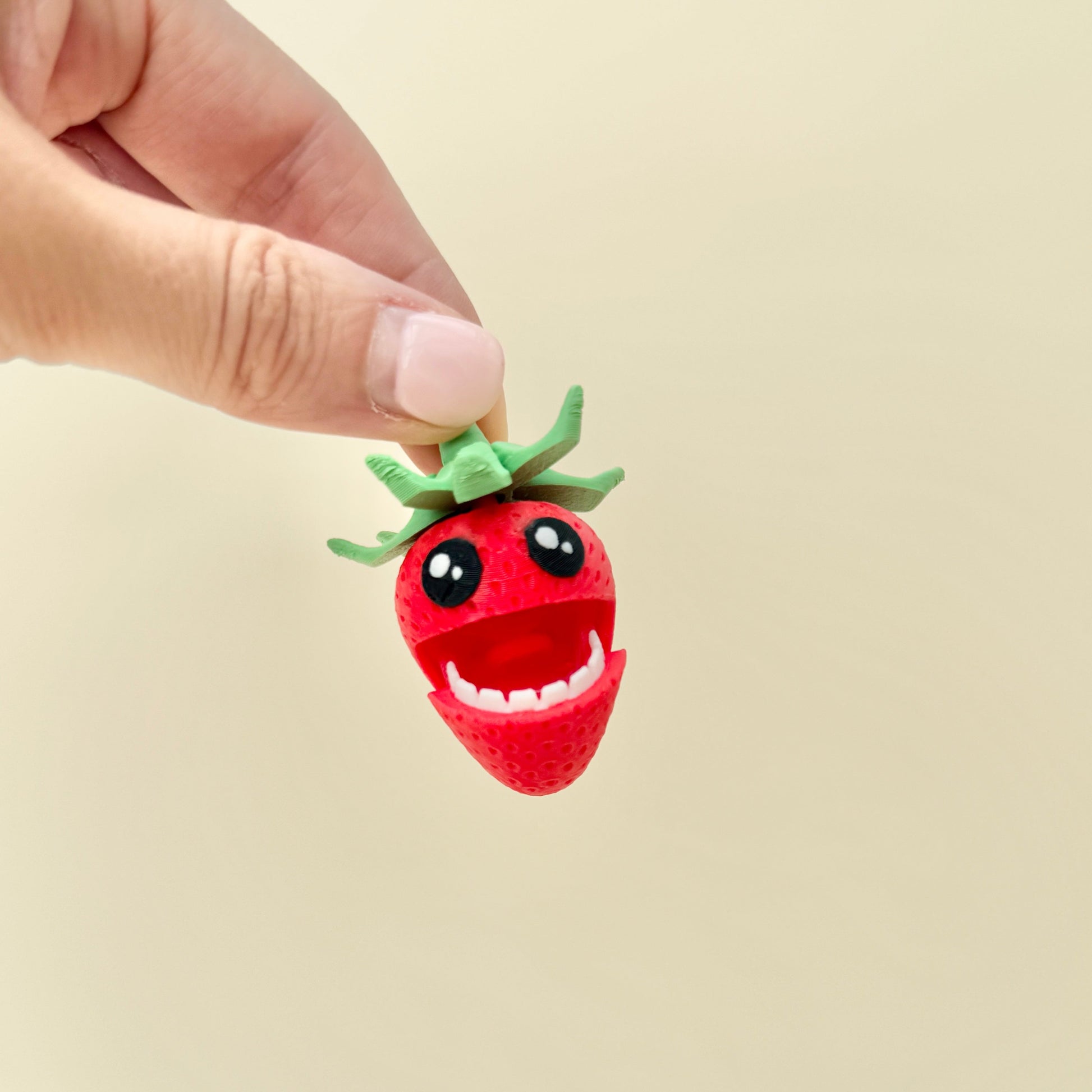 pair of quiet strawberry fidget toys with spinner tops for on-the-go regulation
