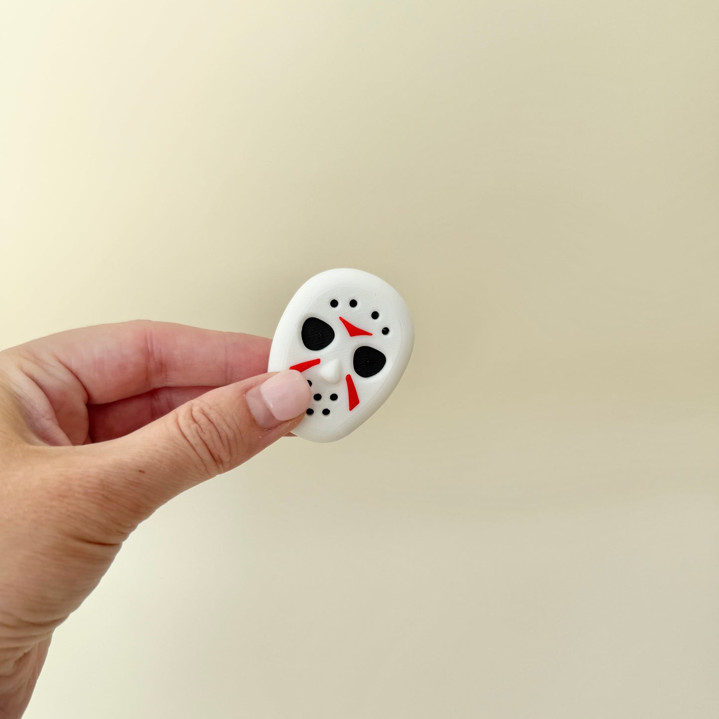 Magnetic sensory fidget with raised textures for tracing, sliding and repeatable motion.