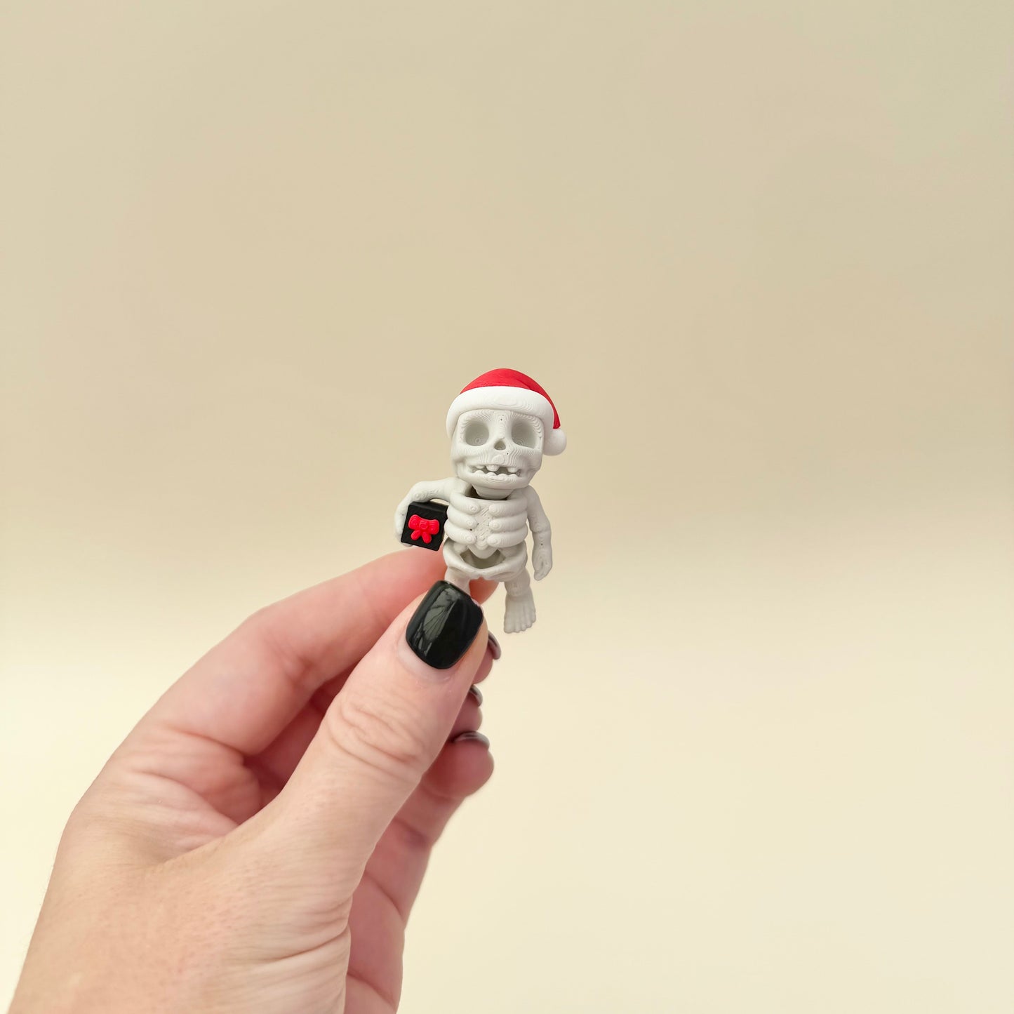 Pocket-size articulated skeleton with winter styling.
