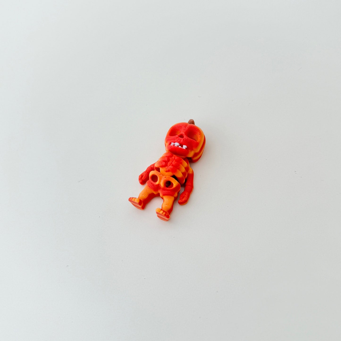 Portable articulated skeleton with vibrant orange gradient finish
