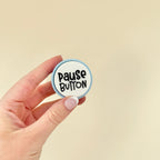 Portable sensory clicker for educators, available in blue, mint, and lilac bases with bold, uplifting words