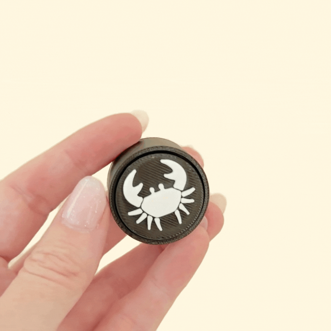 Personalised zodiac clicker, compact and portable, featuring tactile click feedback for sensory stimulation.