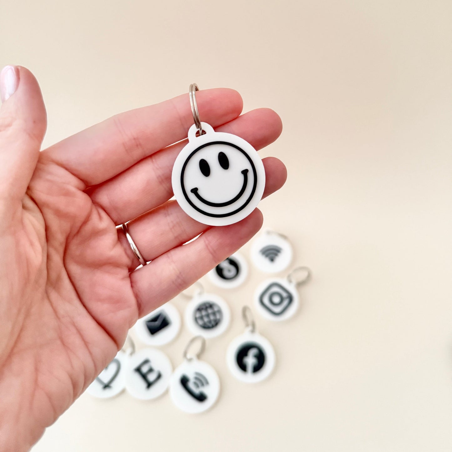 A spread of NFC keyrings in clean black and white designs, offering practical and stylish solutions for everyday connectivity.