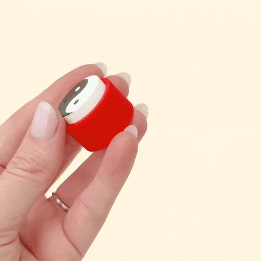 Small stim toy with harmonious black and white design.