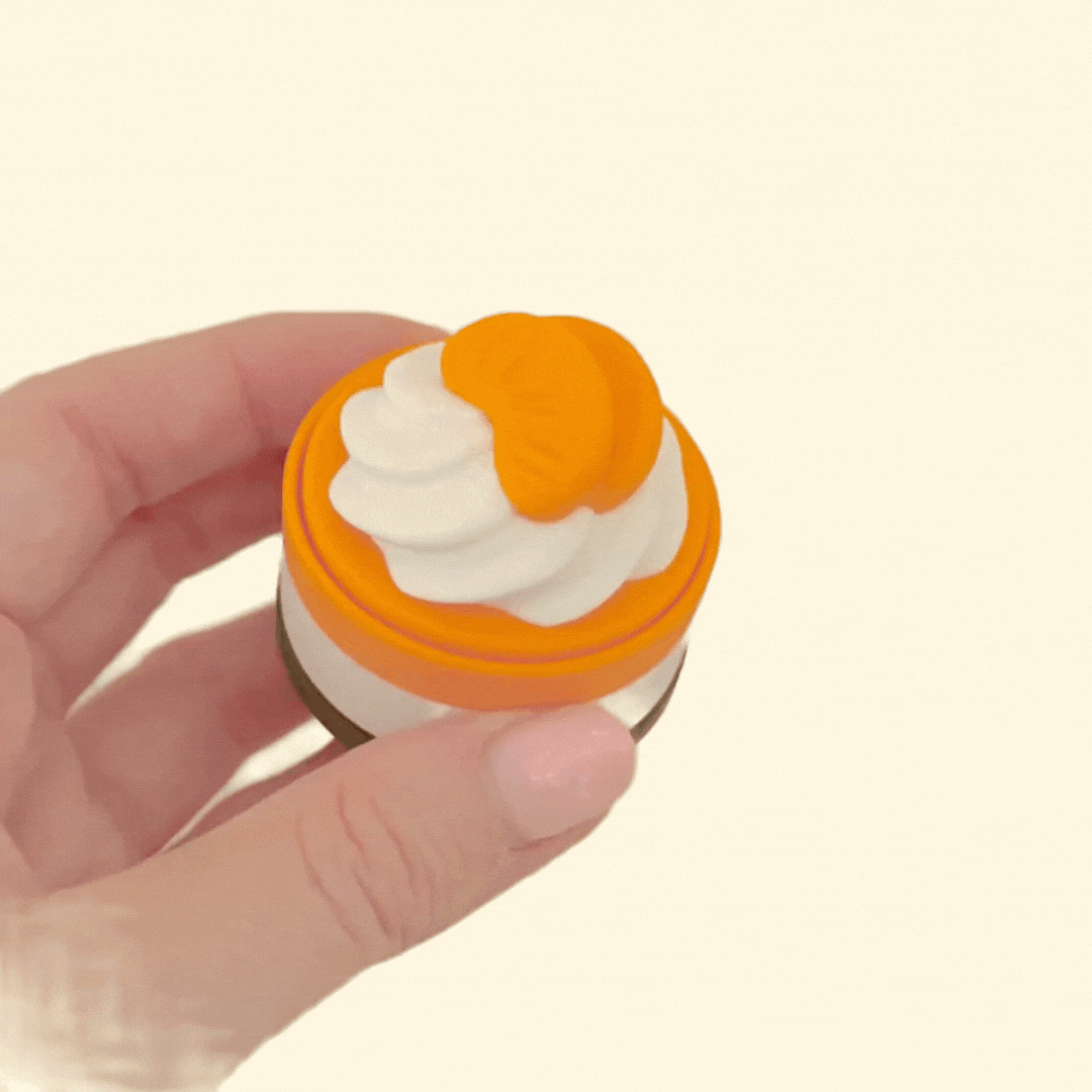 Compact sensory clicker fidget inspired by mini cakes, satisfying press action with optional quiet click upgrade
