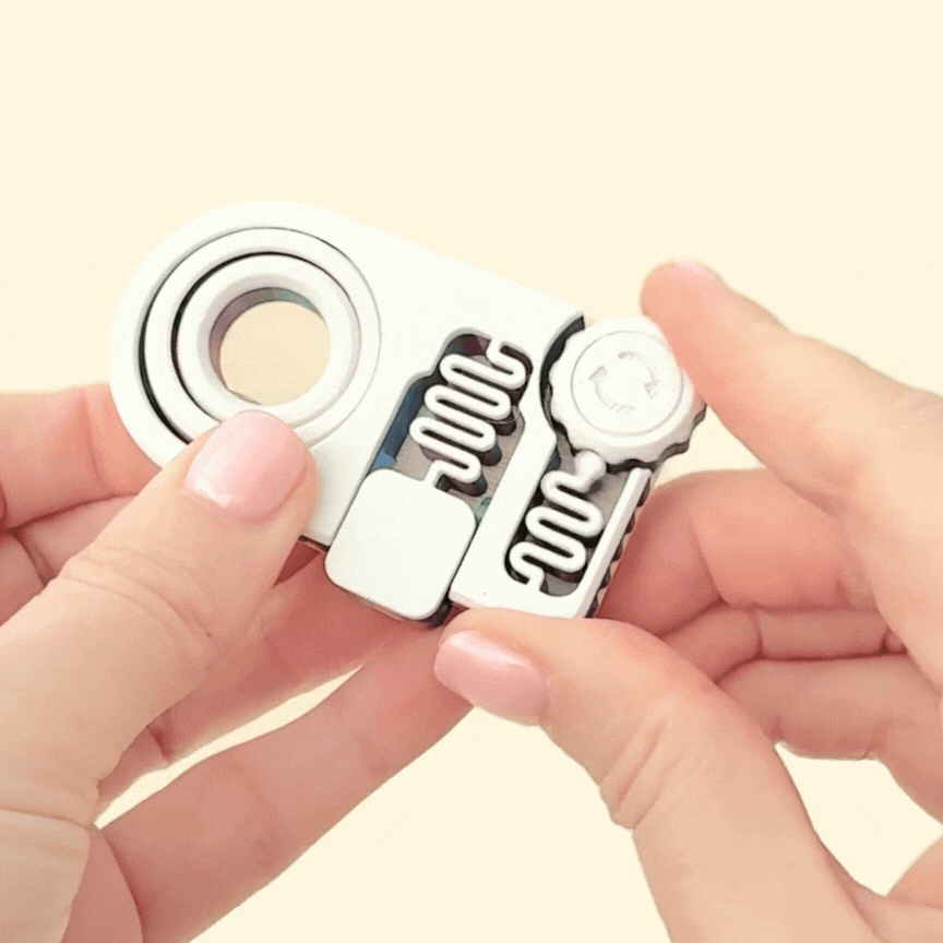 A 7cm multi-action fidget toy featuring a gyro spinner, clicking cog wheel, and silent button for tactile sensory play.