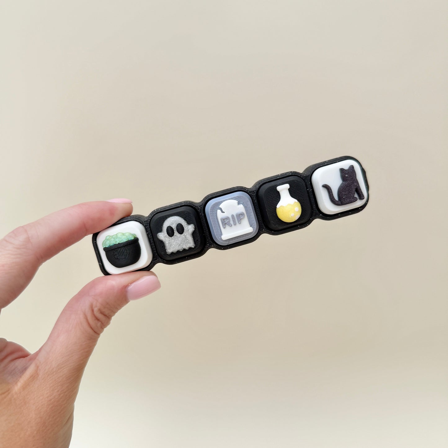 handheld clicking fidget with wrist strap
