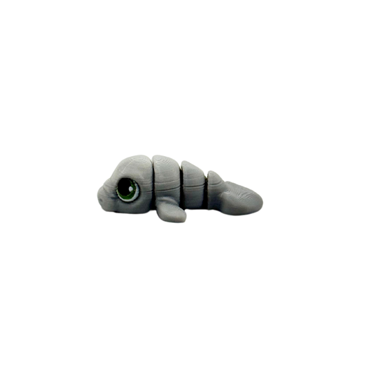 Small 3D-printed fidget with textured detailing for calming input
