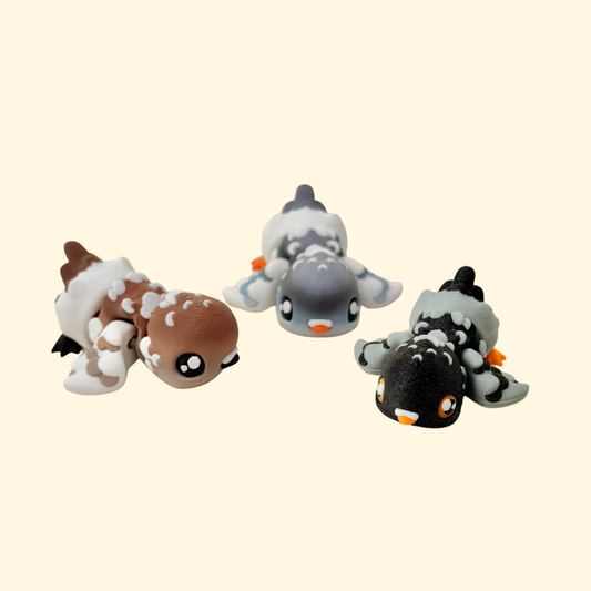 Feather-inspired ridges on a compact articulated bird toy for tactile feedback and discreet fidgeting.
