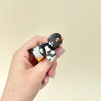 Fully flexible pigeon fidget with orange details and wing articulation.