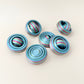 Smaller rainbow fidget spinner with textured edges for a secure grip, ideal for children.