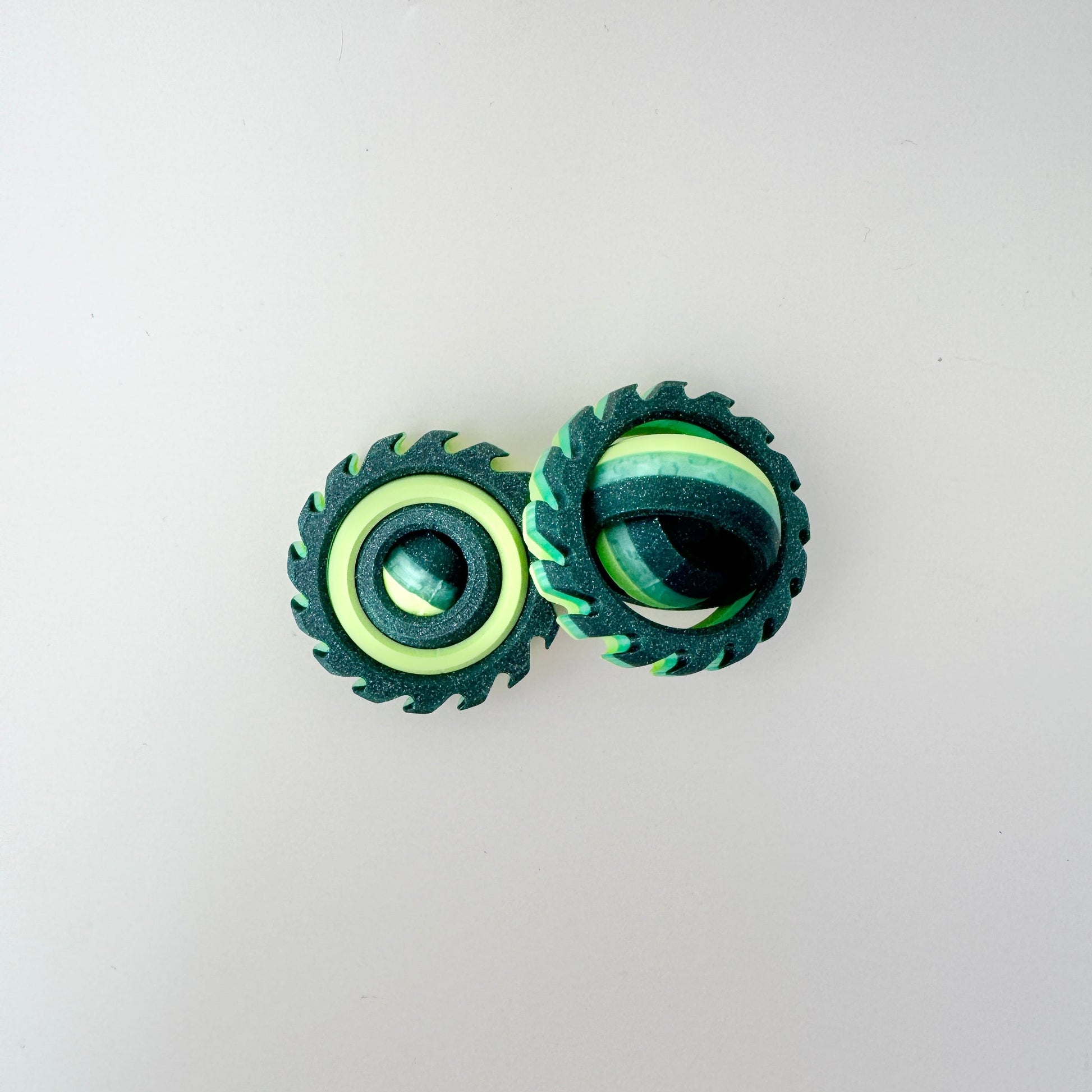 handheld spinner toy with ridged edge for thumb rolls
