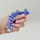 Lightweight palm-friendly fidget with subtle texture and steady feedback; ideal for everyday stimming and focus.
