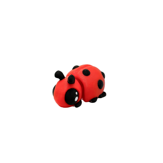 Small sensory fidget with ridges, bumps and quiet motion for grounding
