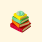 Compact 4 cm stack where the top book presses down for a satisfying click.
