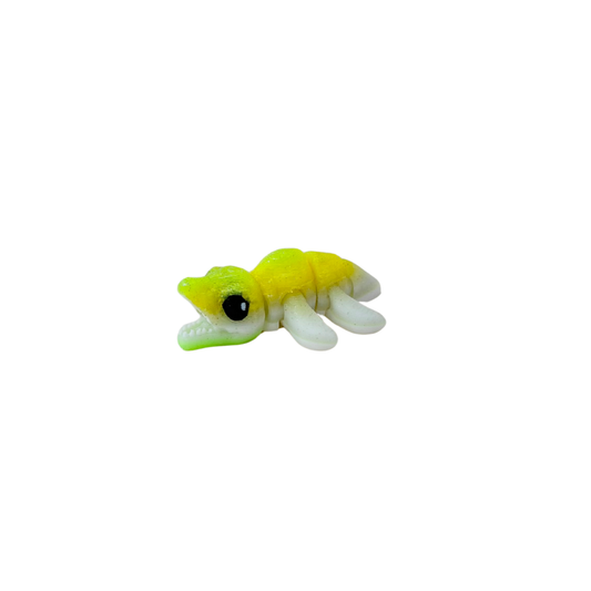 Handheld articulated mini-pet with relaxing motion path and rounded edges; ideal for queues, car rides and classrooms.
