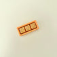 Three-button rectangular clicker toy providing tactile feedback for focus and relaxation

