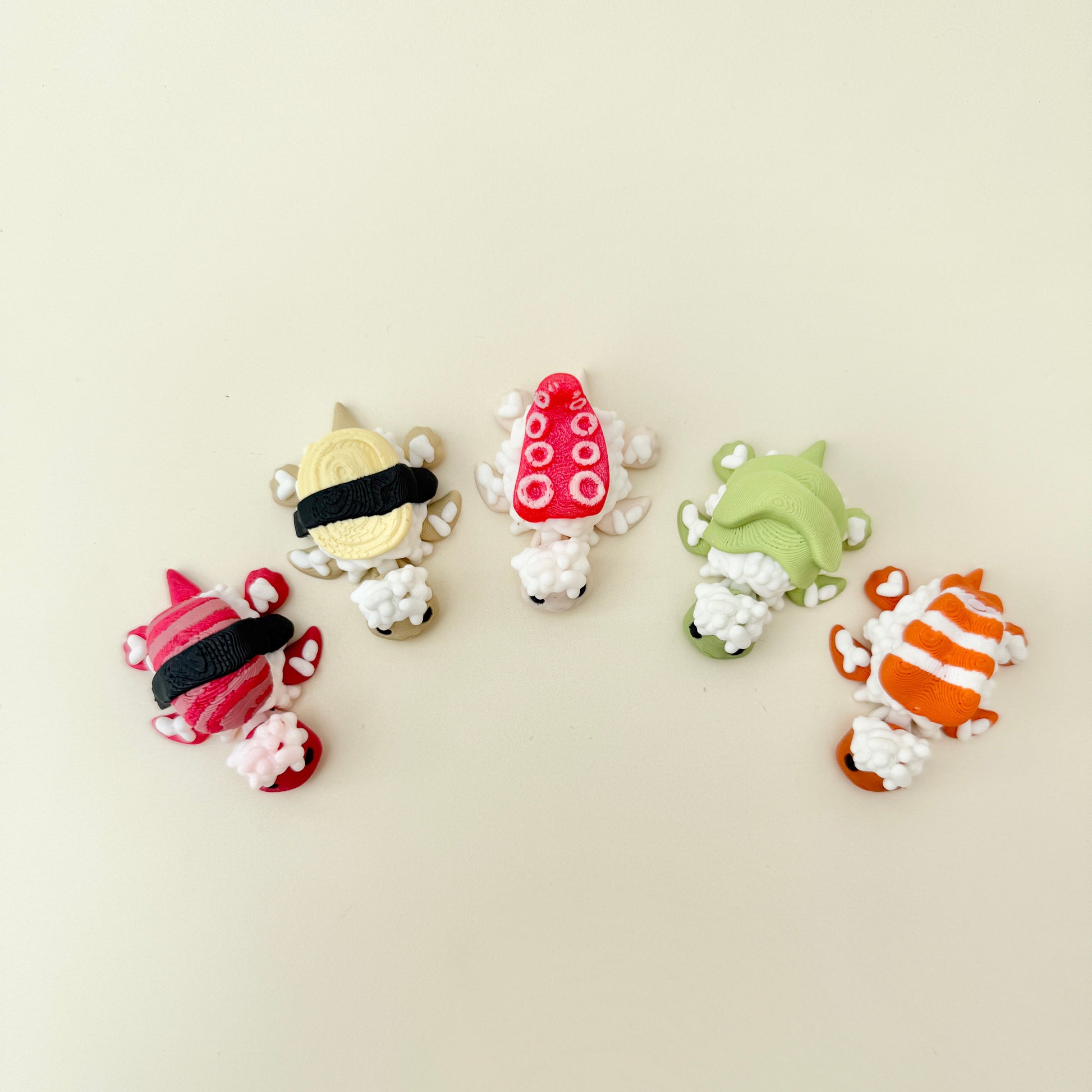 Textured rice turtle with tuna sashimi topping and articulated limbs for quiet fidgeting.
