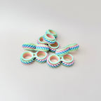 Twist & Roll fidget toy, 6cm in length, featuring two interlocking wheels that spin and twist on the fingers.