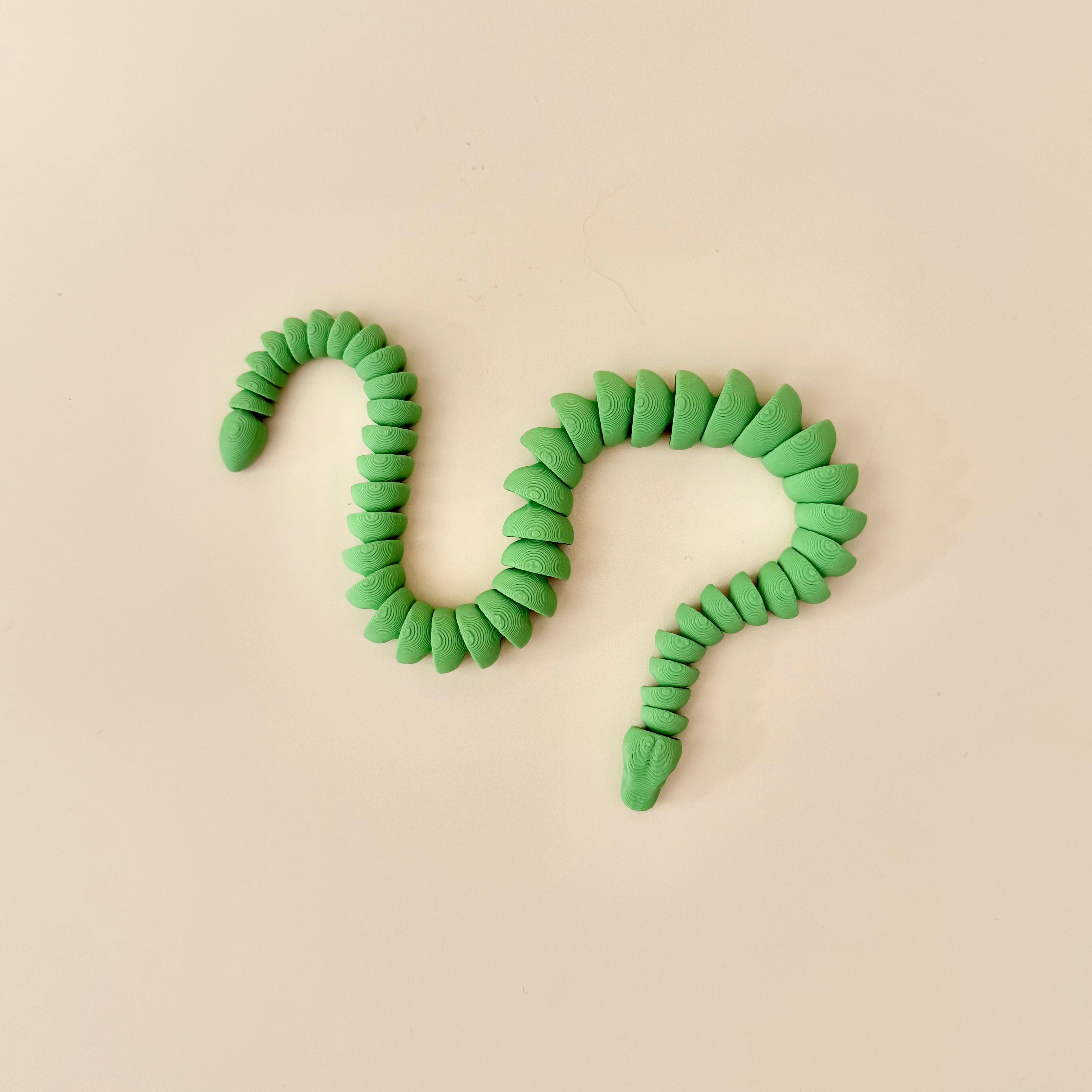 Bendy articulated snake fidget for focus breaks, grounding and satisfying tactile movement.
