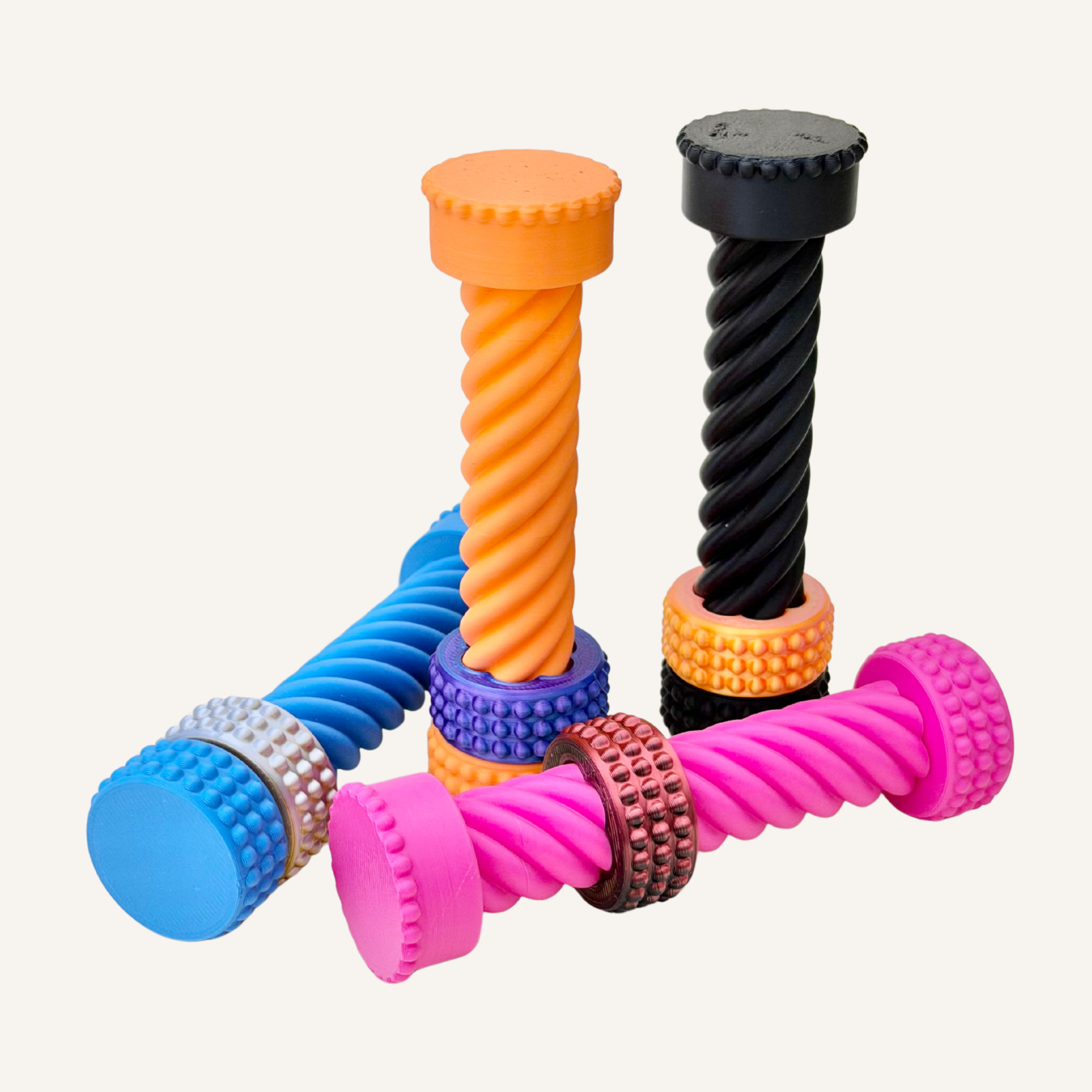 Spiral desk fidget with a sliding colour-shift ring designed for visual stimming and repetitive twisting motion.
