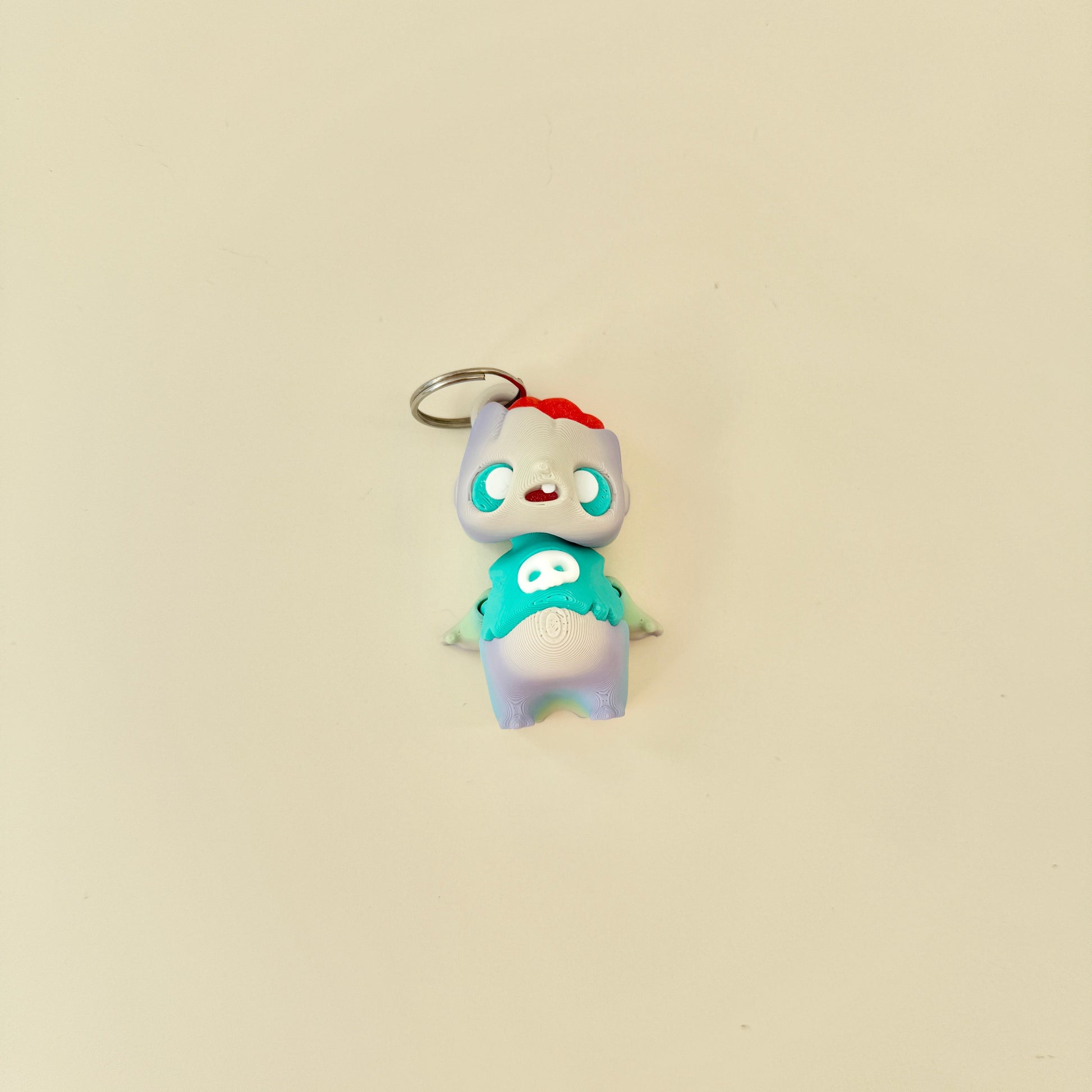 Small spooky-cute fidget figure with moving head and arms for quiet stimming.
