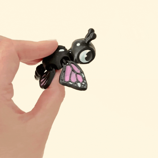 Sensory-friendly fidget turtle with butterfly-style articulated wings for calming play