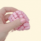 Pale pink flexi heart sensory fidget with soft-touch texture and bendy mesh design for soothing motion.
