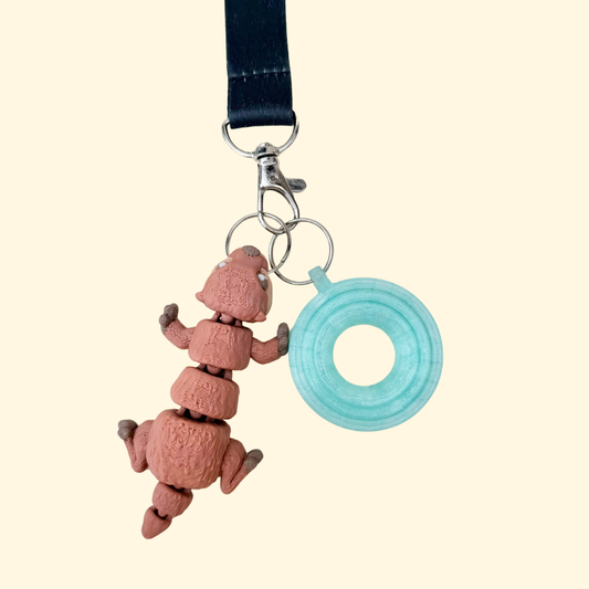 Lightweight fidget add-on on a silver loop, made for lanyards, keys, bags or ID clips.
