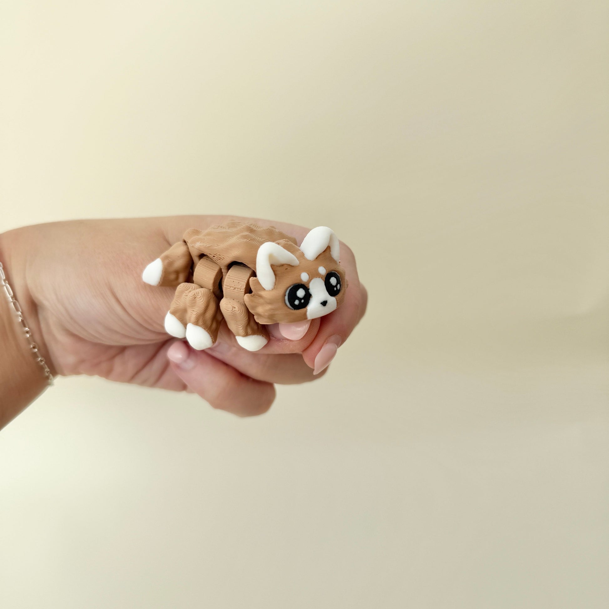 compact tactile fidget with fur-like texture for thumb tracing and focus breaks

