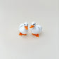 Exclusive white duck fidget toy with orange beak and legs, able to stand up on its own, perfect for tactile engagement.

