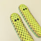 large pickle-style stim toy offering tactile input without click sounds
