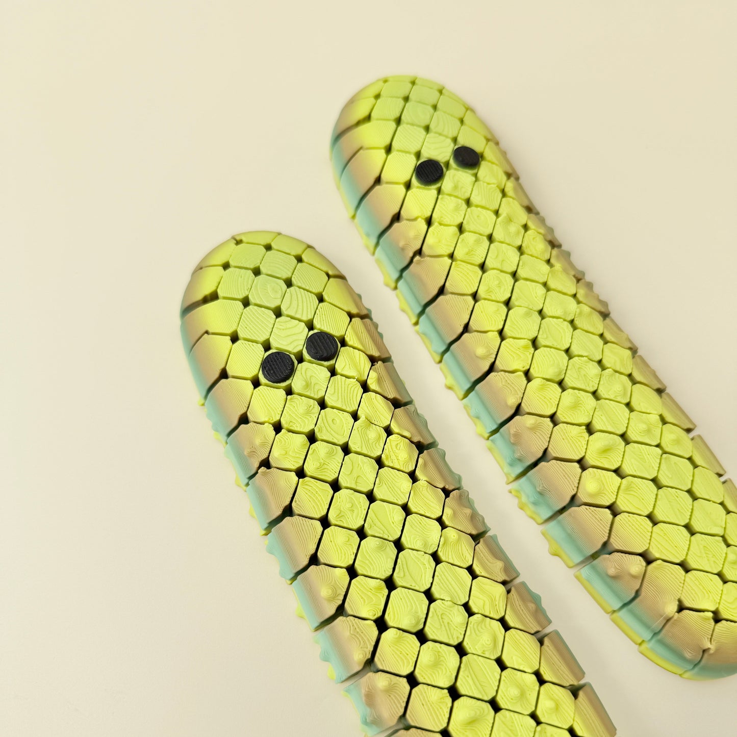 large pickle-style stim toy offering tactile input without click sounds
