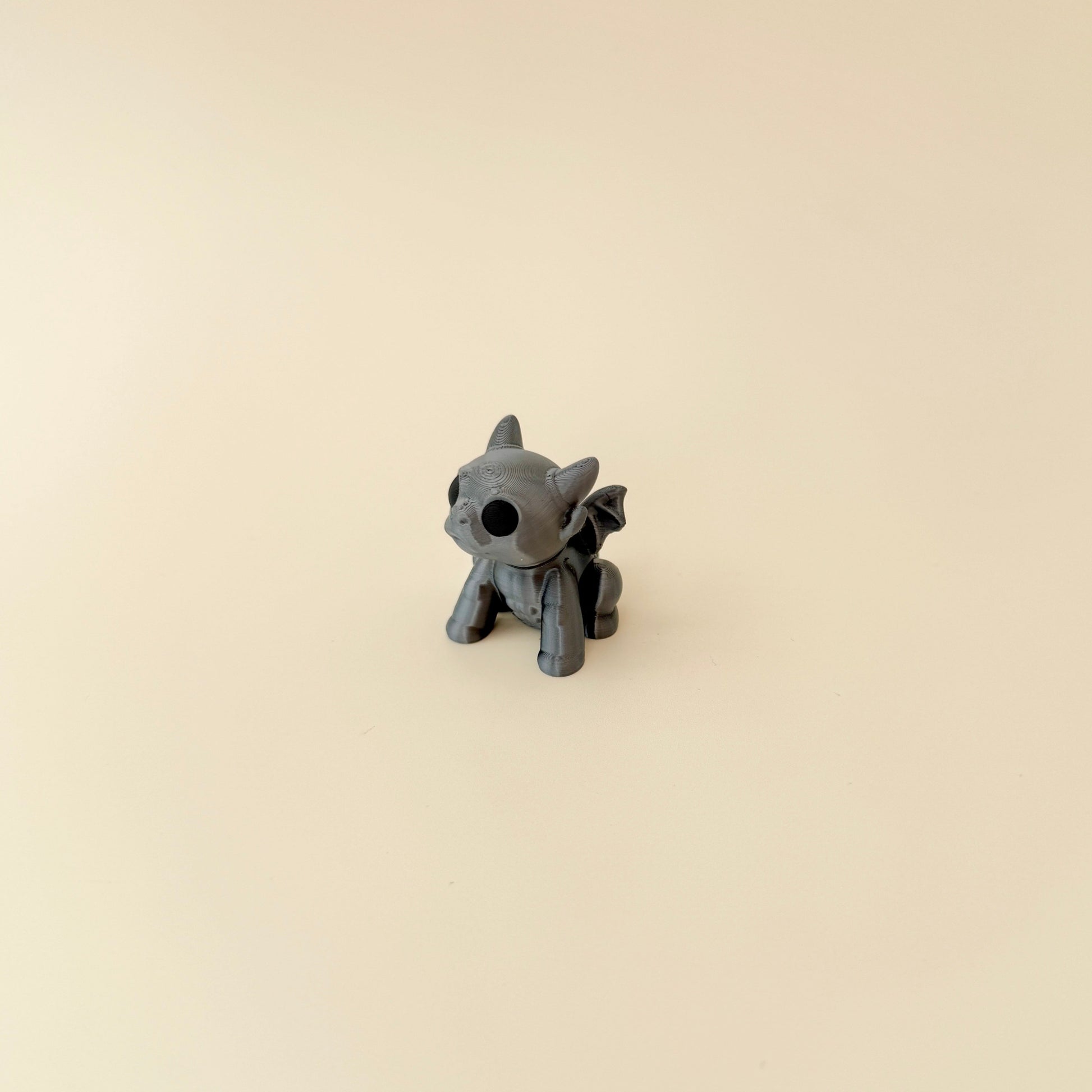 mini gargoyle figurine with horns and tactile details for grounding
