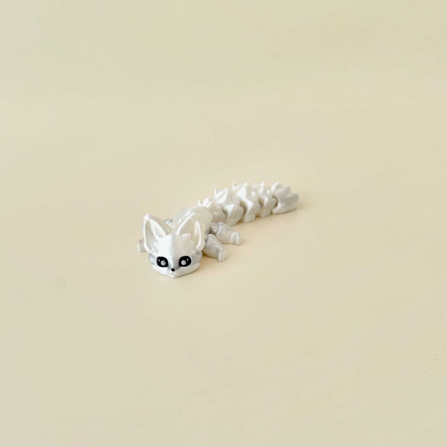 Hand-sized fox fidget, fully movable links for rhythmic motion and focus support.

