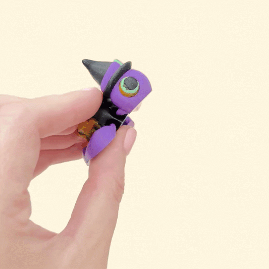 Purple turtle fidget with spooky Halloween design and bubbling cauldron textures
