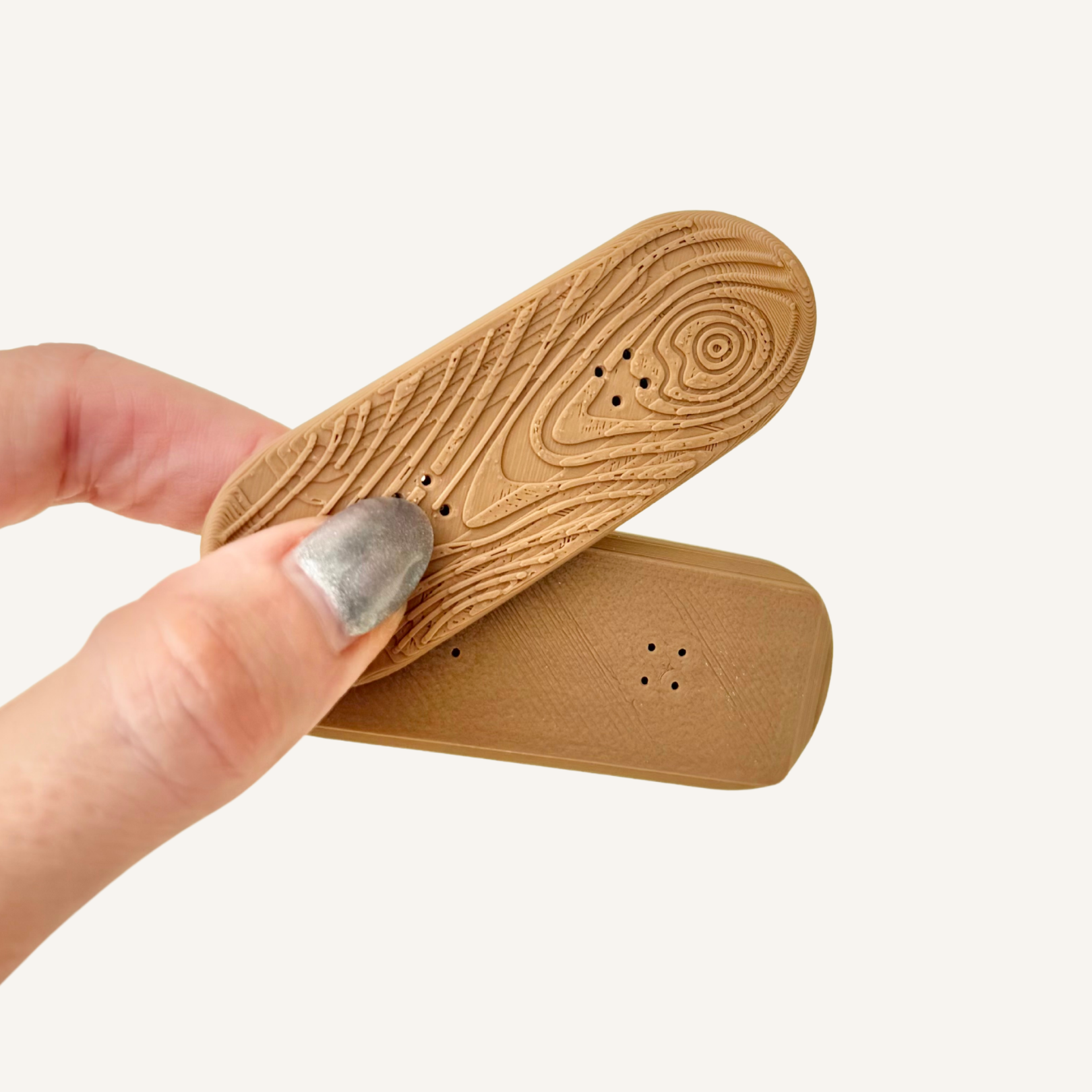 Handheld magnetic sensory fidget printed in wood filament with textured detail for grounding and busy hands.
