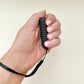 handheld non-click fidget with firm spikes for discreet use at work or school
