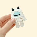 White Yeti fidget toy with frosted blue features, articulated arms and feet, 8cm in height.