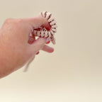 The fidget snake showing its smooth articulation and flexible movement for sensory play.