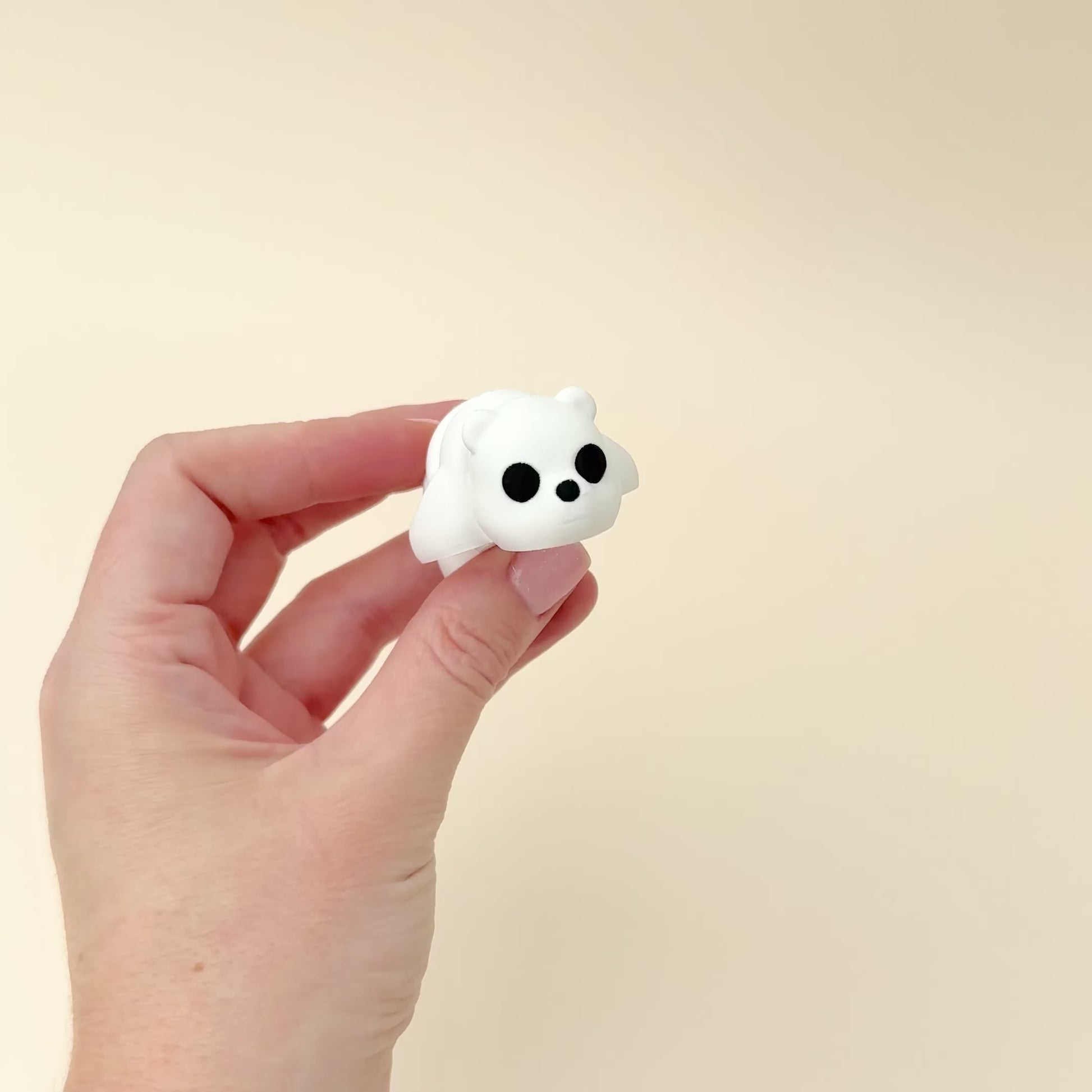 Compact polar bear fidget toy, suitable for desks or on-the-go use, showcasing its realistic design.