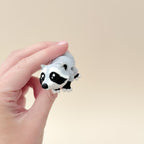 Realistic raccoon fidget toy with lifelike details, movable body parts, and a compact 10cm size.